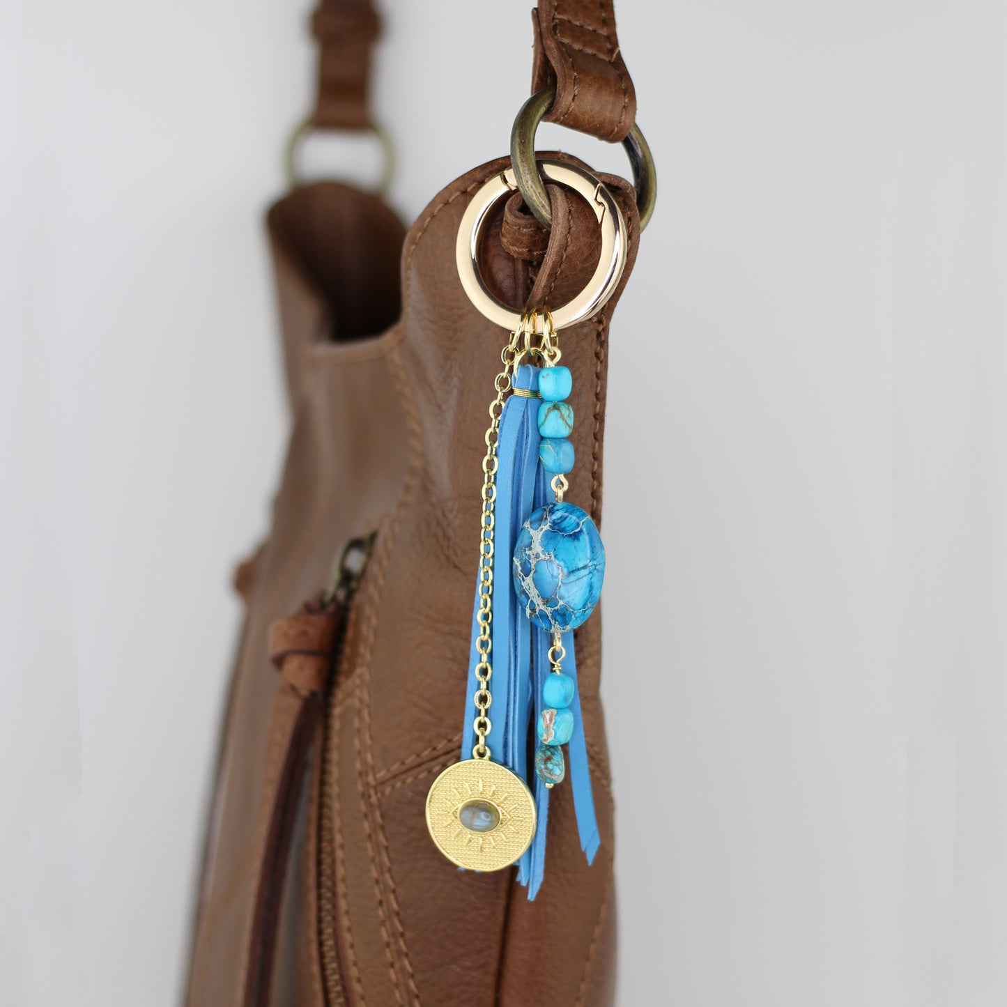 Blue Impression Jasper, Evil Eye Charm, and Turquoise Blue Leather Tassel Bag Charm